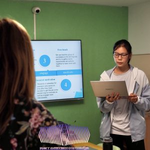Flora, student, presenting real case solution