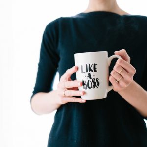 Lady holding a mug saying "like a boss"