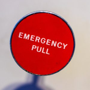 Red Circle Board showing Emergency Pull in the middle