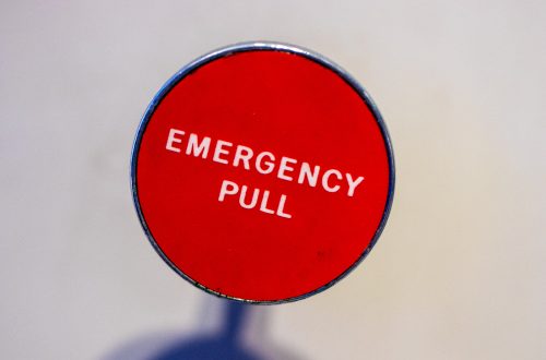 Red Circle Board showing Emergency Pull in the middle